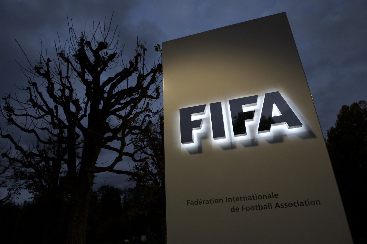 This photo taken on October 8, 2015 in Zurich shows the entrance sign with the logo at the FIFA world headquarters. Photo by Fabrice COFFRINI / AFP