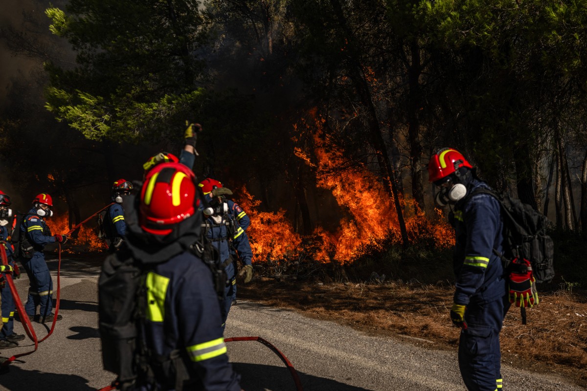 Greek firefighters try to extinguish a wildfire in the area of Porto Germeno, some 70 kilometres (45 miles) northwest of Athens in the region of Viotia, on August 2, 2026. Photo by ANGELOS TZORTZINIS / AFP