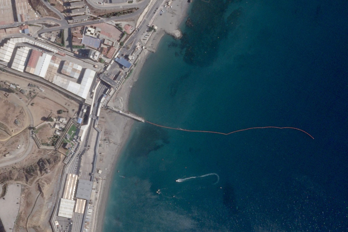 This handout satellite photograph, taken on August 2, 2026, and released by Planet Labs PBC, shows the waterline marking the Spain-Morocco maritime border off Spain's North African enclave of Ceuta. Photo by Handout / 2026 Planet Labs PBC / AFP