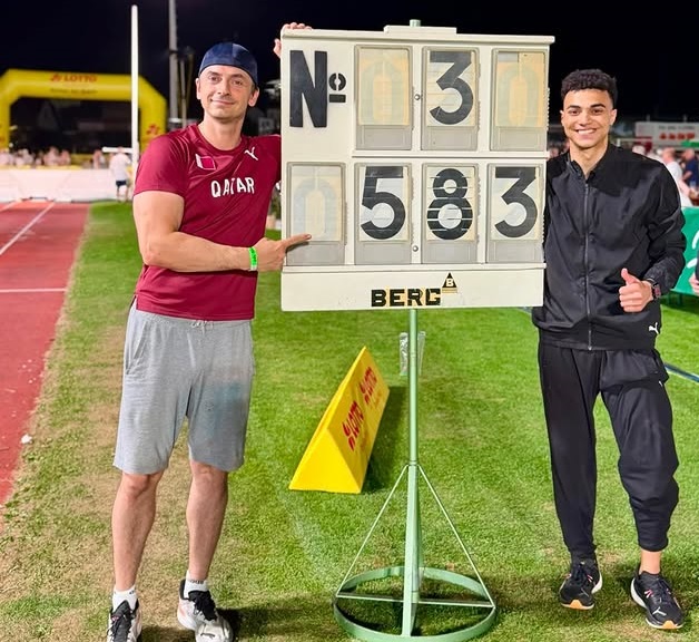 Qatar pole vaulter Saif Mohammed celebrates with his coach after winning the silver medal.