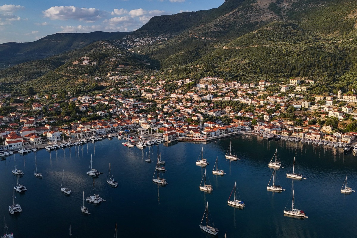 This photo taken on August 4, 2026, shows an aerial view of the town of Vathy on the island of Ithaca. Photo by Angelos TZORTZINIS / AFP