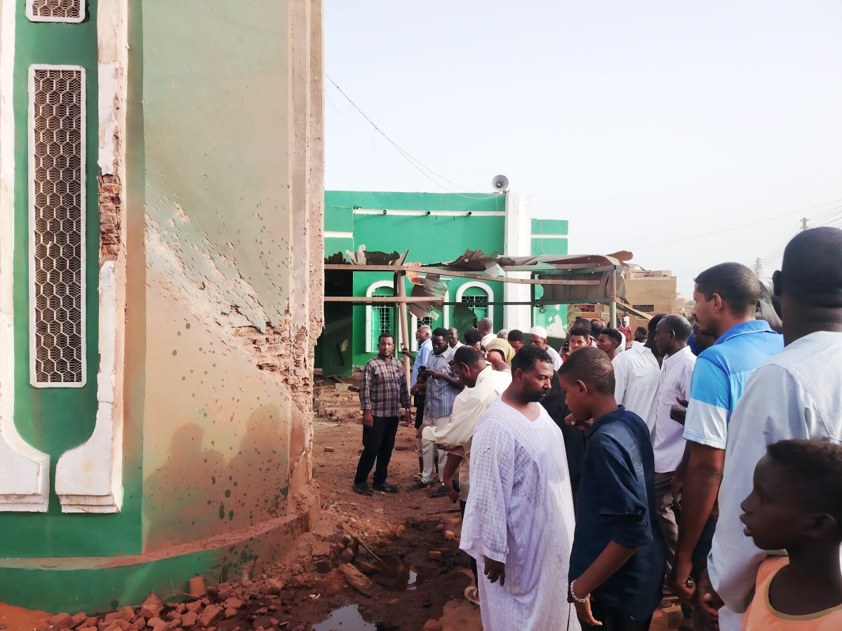This photo taken with a mobile phone shows residents inspecting a drone-attacked mosque in Al-Droshab, north of Sudan's capital Khartoum on Aug. 12, 2026. (Photo by Mohamed Khidir/Xinhua)