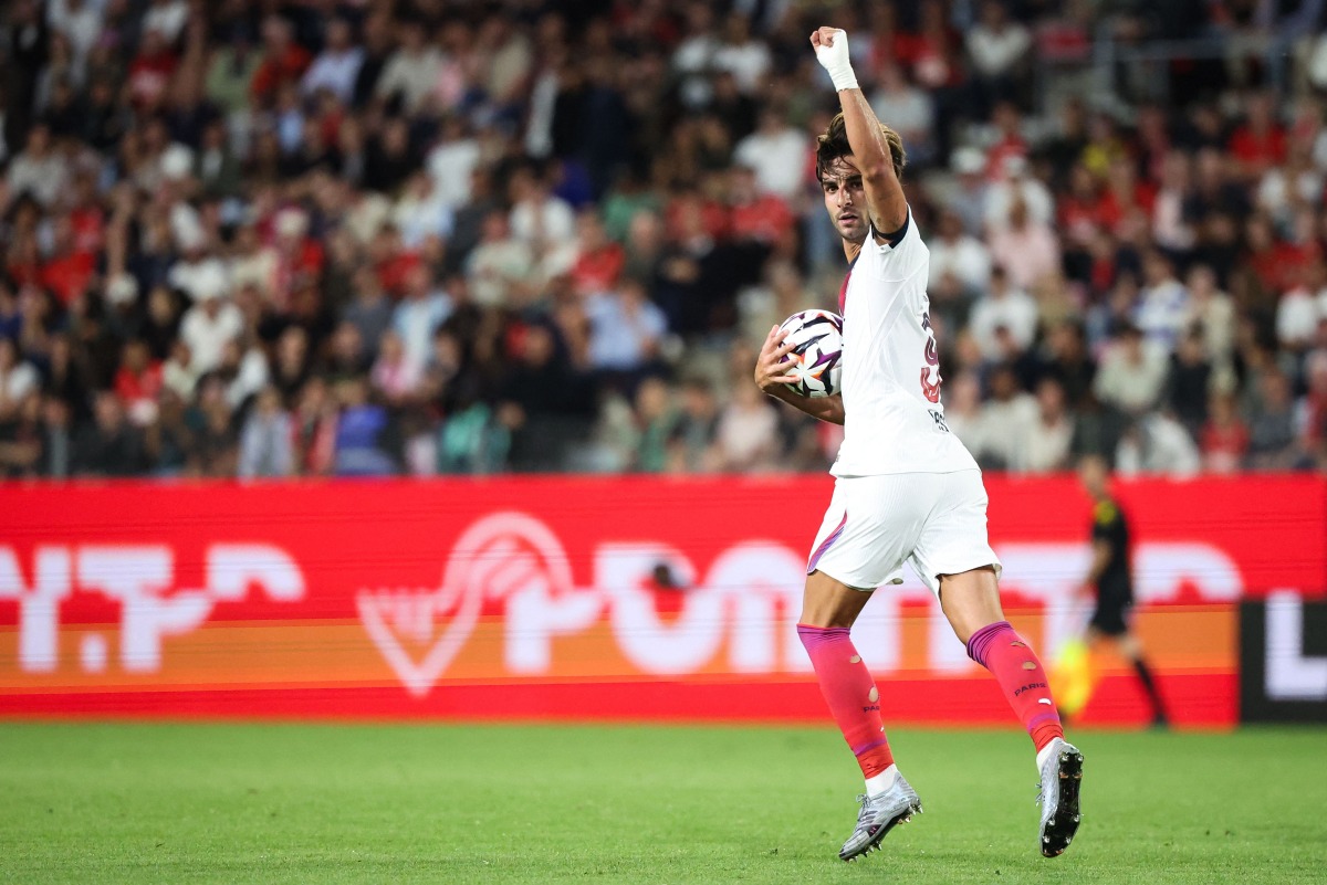PSG's Spanish forward #09 Ferran Torres celebrates after scoring his team first goal during the French L1 football match between Stade Rennais FC and Paris Saint-Germain (PSG) at the Roazhon Park stadium in Rennes, western France on August 23, 2026. (Photo by ALAIN JOCARD / AFP)