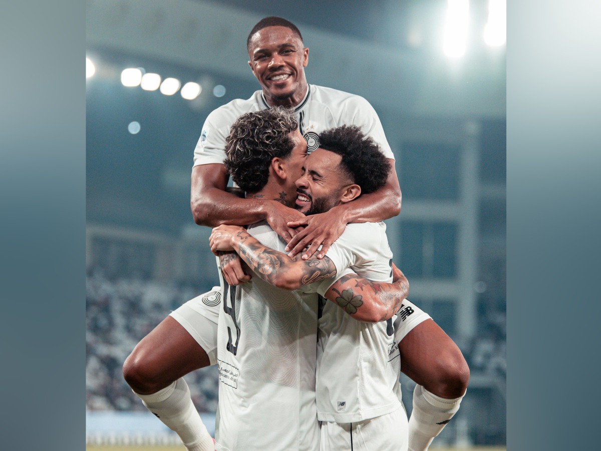 Al Sadd players celebrate during their match against Al Ahli on Saturday.