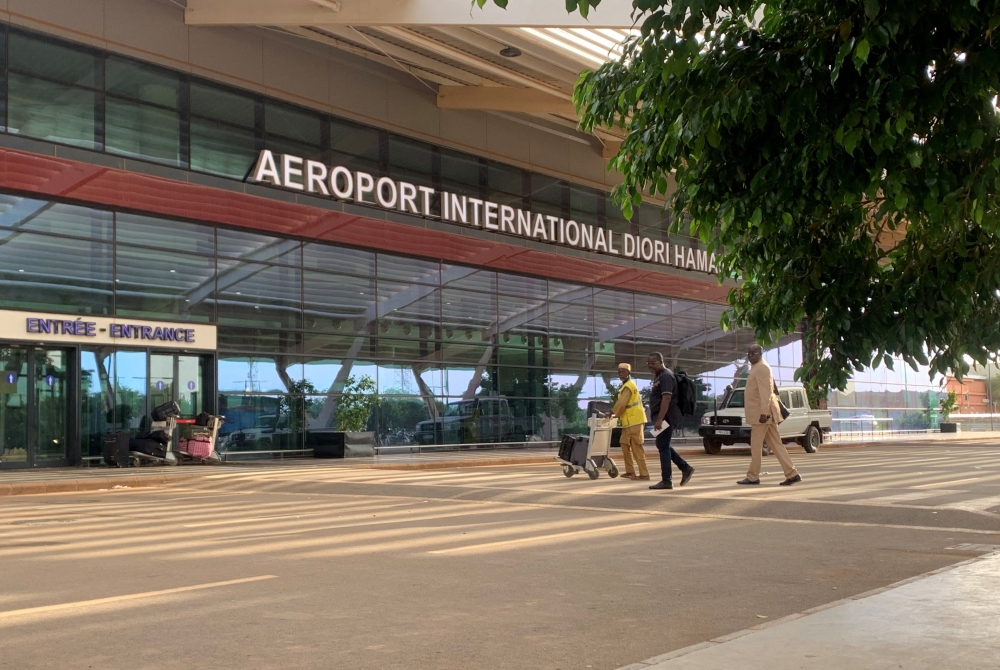 (FILES) Passengers arrive at the Diori Hamani International airport in Niamey on September 22, 2023. (Photo by AFP)