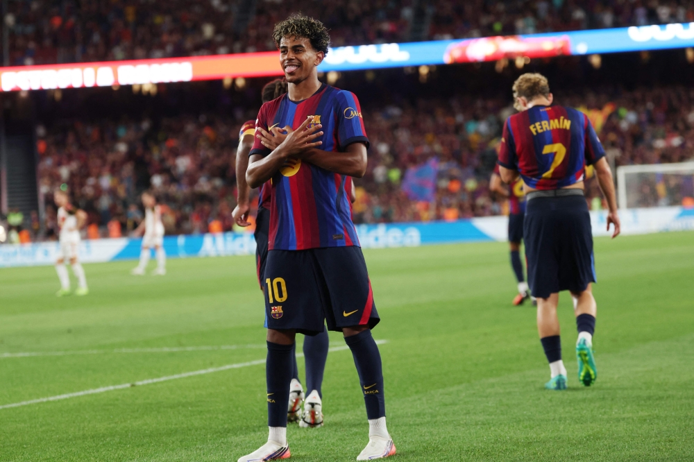 Barcelona's Spanish forward #10 Lamine Yamal celebrates scoring his team's fifth goal during the Spanish league football match between FC Barcelona and Rayo Vallecano de Madrid at Camp Nou Stadium in Barcelona on August 31, 2026. (Photo by Lluis GENE / AFP)