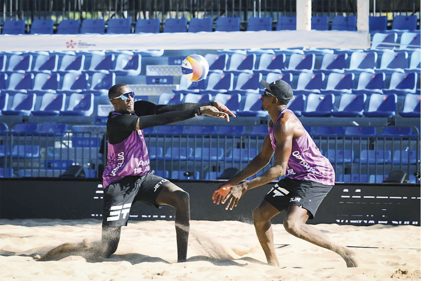 Qatar’s Cherif Younousse (left) and Ahmed Tijan in action during their match yesterday. 