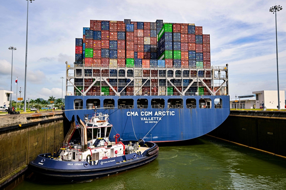  The container ship CMA CGM Arctic, sailing under the Maltese flag, passes through the Cocoli Locks of the Panama Canal in Panama City on September 3, 2026, ahead of reduced transit measures linked to the El Nino weather phenomenon that are set to come into force on September 4. (Photo by MARTIN BERNETTI / AFP)