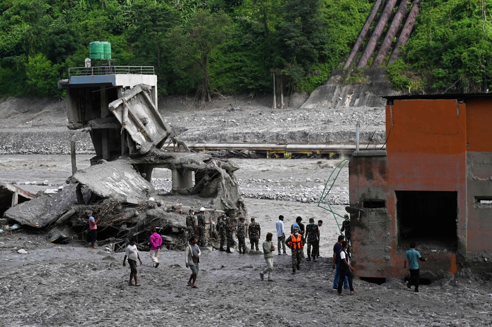 Security and relief personnel stand along the Trishuli riverbank in the aftermath of flash floods at Trishuli Bazar in Nepal's Nuwakot district on September 5, 2026. File photo. Representational.