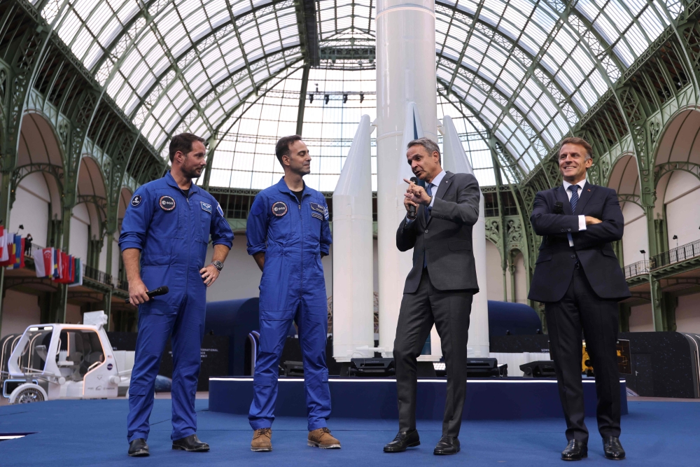 (From L) French European Space Agency (ESA) astronaut Thomas Pesquet, Greek aviation medical examiner and European Space Agency (ESA) astronaut candidate Adrianos Golemis, Greece's Prime Minister Kyriakos and France's President Emmanuel Macron speak during the International Space Summit at the Grand Palais in Paris on September 9, 2026. (Photo by Ludovic MARIN / POOL / AFP)