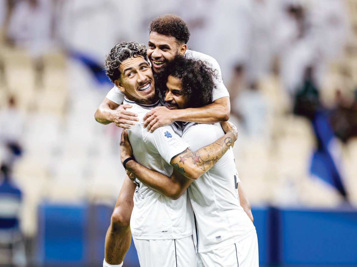 FROM LEFT: Al Sadd's Roberto Firmino, Hashem Ali and Akram Afif celebrate a goal.