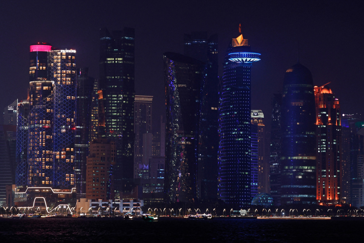 The skyline of illuminated high-rise buildings is seen along the Corniche Promenade in Doha on September 4, 2026. (Photo by Karim Jaafar / AFP)
