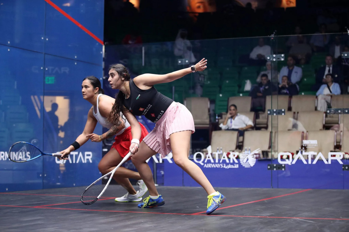 Rachel Arnold (left) and Nour ElSherbini in action during their match yesterday.  