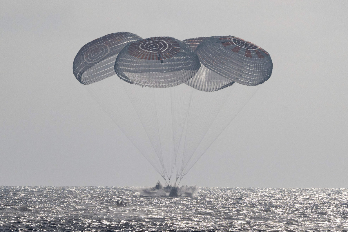 This picture provided by NASA shows the SpaceX Crew Dragon Freedom spacecraft as it lands with NASA astronauts Jessica Meir, Jack Hathaway, ESA (European Space Agency) astronaut Sophie Adenot, and Roscosmos cosmonaut Andrey Fedyaev aboard in the Pacific Ocean off the coast of Los Angeles, California, on October 8, 2026. Photo by Keegan Barber / NASA / AFP