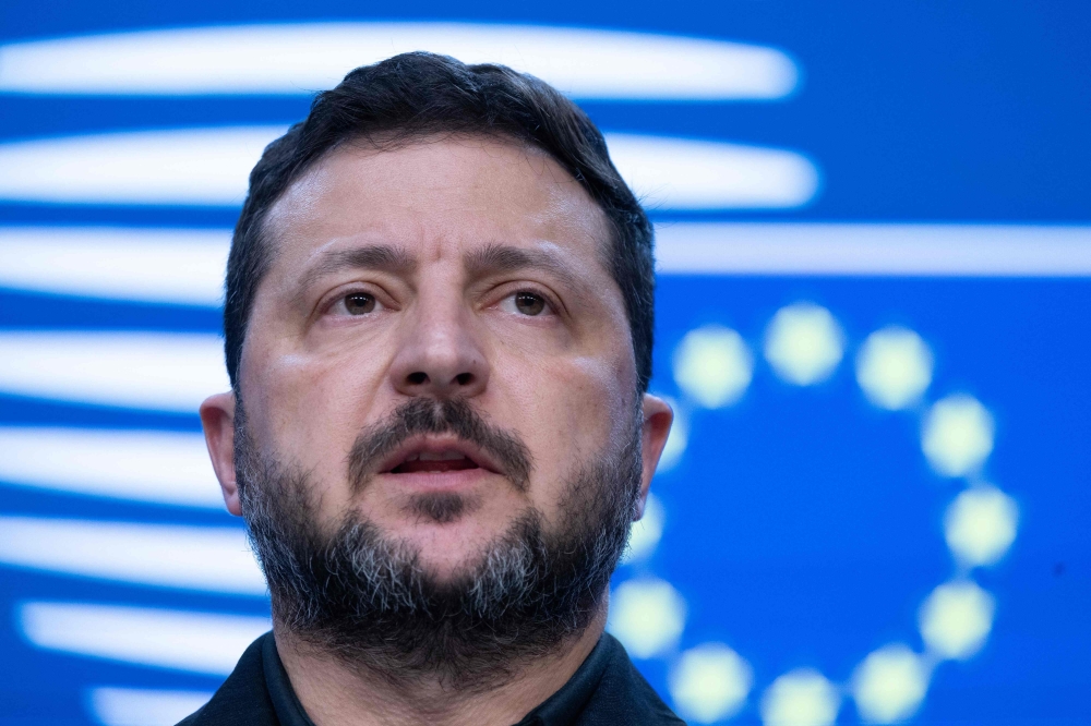 Ukraine's President Volodymyr Zelensky speaks during a press conference as part of a European Union summit at the EU headquarters in Brussels on October 16, 2026. (Photo by Nicolas Maeterlinck / Belga / AFP)