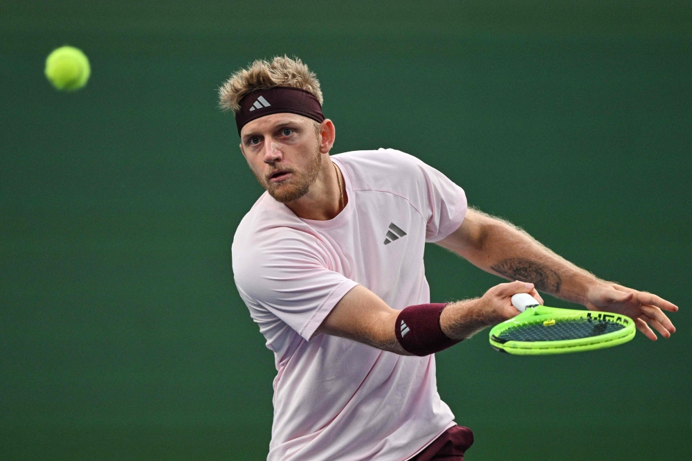 Spain's Alejandro Davidovich Fokina hits a return to Germany's Alexander Zverev during their men's singles semi-final match at the Shanghai Masters tennis tournament in Shanghai on October 17, 2026. (Photo by Hector Retamal / AFP)