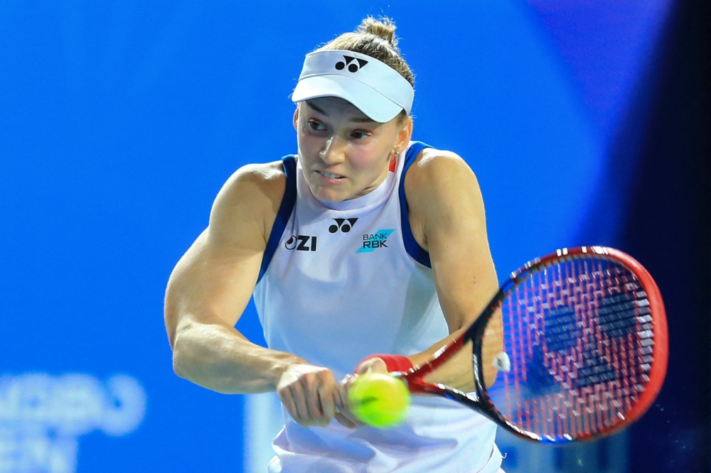 Kazakhstan's Elena Rybakina hits a return to Russia's Diana Shnaider during their women's singles semifinal match on October 24, 2026. (Photo by CN-STR / AFP)