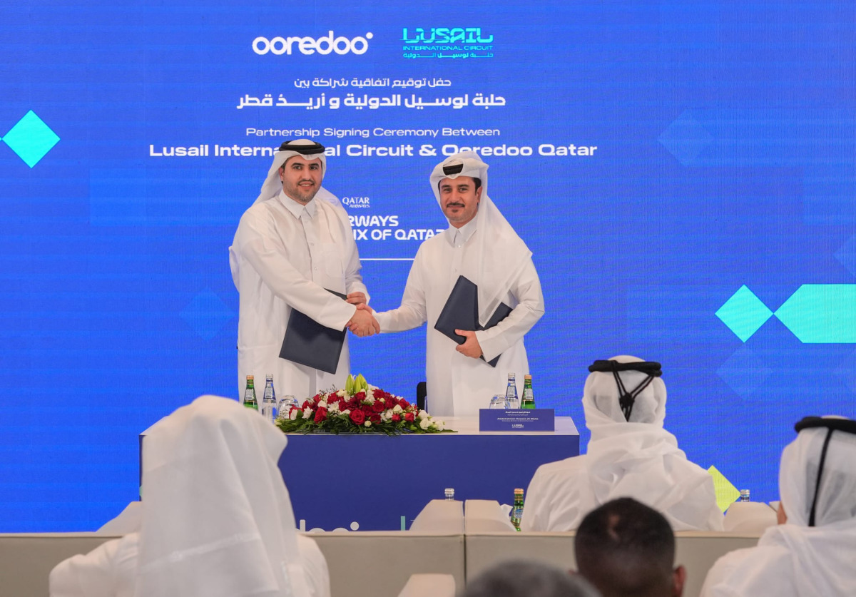 Lusail International Circuit Shared Services Executive Director Abdulrahman Hassen Al Mulla (right) and Ooredoo Qatar Chief Strategy and Digital Transformation Officer Thani Ali Al-Malki shake hands after announcing the partnership.