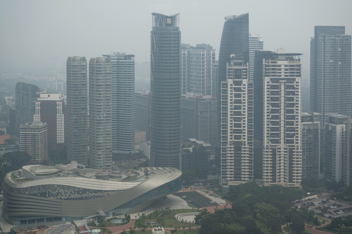 High-rise buildings are seen in Kuala Lumpur on October 20, 2026, as Malaysia continues to be shrouded in haze. (Photo by Mohd Rasfan / AFP)
