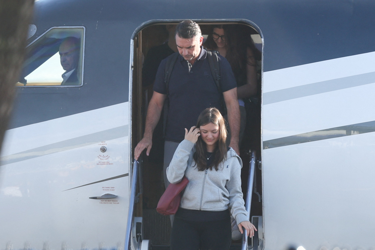 Flavio Bolsonaro steps off a plane after arriving at Opa Locka Executive Airport in Miami, Florida on October 28, 2026. Photo by Ricardo Arduengo / AFP

